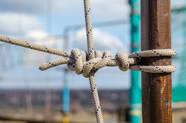many ropes and one big knot close up