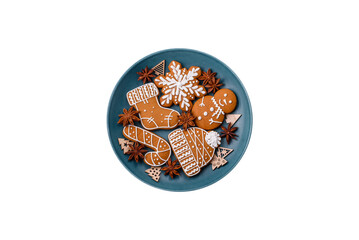 Beautiful Christmas gingerbread cookies of different colors on a ceramic plate