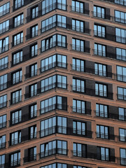 Fototapeta premium Windows of a modern apartment building in City.