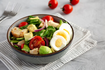 Homemade Honey Mustard Chicken Salad in a Bowl, side view. Close-up.