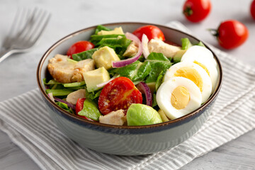 Homemade Honey Mustard Chicken Salad in a Bowl, low angle view. Close-up.
