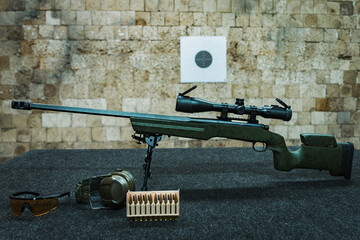 American sniper rifle at a shooting range.