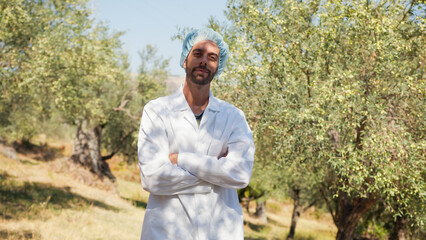 Agronomist with lab coat smiling in the countryside
