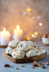 Italian traditional Christmas sweets Cavallucci over grey background with xmas decoration, candles and spices, Vertical banner