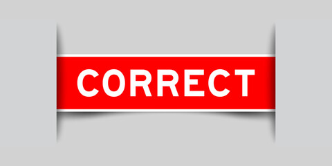 Red color square label sticker with word correct that inserted in gray background