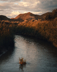 The River's Serene Journey Through the Peaks.