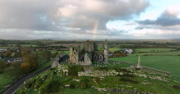 Ancient castle on the background of a rainbow 4k