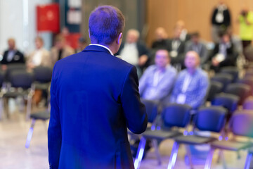 Male business coach speaker in suit give presentation, speaker presenter consulting training...
