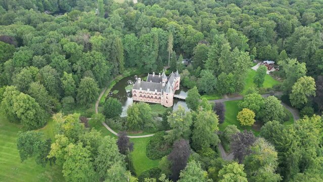 Bird's-Eye View of a Small Castle Standing on Water in the Forest