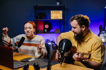 The presenter and the guest perform the song during the radio broadcast. Concept of online...