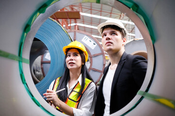 Engineer inspects machinery Maintenance of machinery in the factory.
