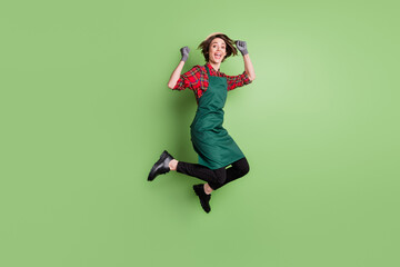 Full body profile portrait of astonished lady fists up open mouth shout yes isolated on green color background - obrazy, fototapety, plakaty