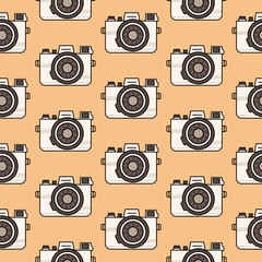 Cute seamless pattern light vintage camera in retro colors isolated on a beige background. Background, backdrop, wrapping paper.