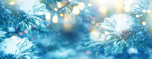 Foto op Canvas  Christmas Tree. Christmas New Year Winter blurred background. Magic winter snow landscape. Christmas greeting card. Christmas lights. Space for text. Banner. © Irene