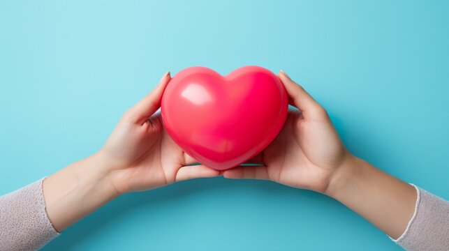 Dos manos sosteniendo un coraz&oacute;n. Concepto del d&iacute;a de los enamorados. Generado por IA.