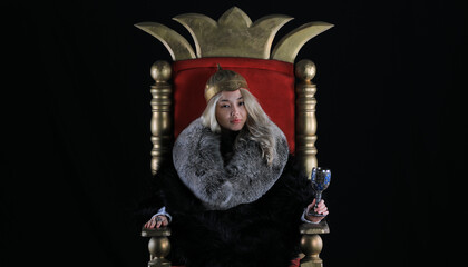 beautiful blonde viking queen on the throne