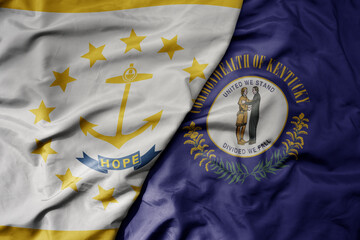 big waving colorful national flag of kentucky state and flag of rhode island state .