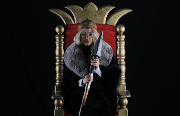 beautiful blonde viking queen on the throne