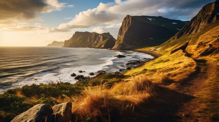  a view of the ocean and mountains from the top of a hill with a path leading up to the top of the hill, with the ocean in the foreground.