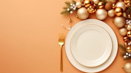 Obraz na płótnie Canvas a white plate sitting on top of a table next to a fork and a christmas ornament on top of a orange background with a gold fork and white plate.