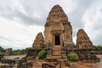 East Mebon - 10th century classical Khmer pyramid temple complex built by Rajendravarman in red...