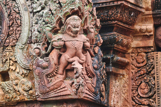Stone Bas reliefs depicting Narasimha, half-man, half-lion from hindu mythology at Banteay Srei - 10th century Hindu temple and masterpiece of old Khmer architecture at Siem Reap, Cambodia, Asia