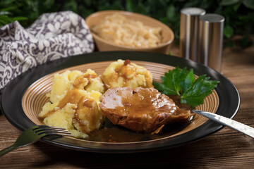 Braised pork neck in own sauce. Shallow depth of field.