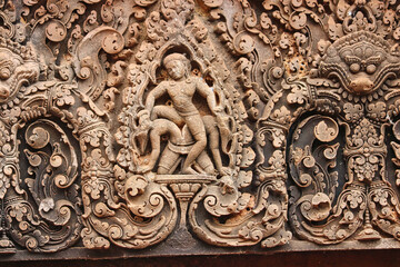 Stone Bas reliefs from hindu mythology at Banteay Srei - 10th century Hindu temple and masterpiece of old Khmer architecture at Siem Reap, Cambodia, Asia