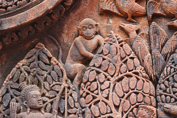 Money Stone Bas relief from hindu mythology at Banteay Srei - 10th century Hindu temple and masterpiece of old Khmer architecture at Siem Reap, Cambodia, Asia