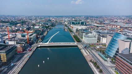 Obraz premium Aerial shot of cityscape of Dublin and the Samuel Beckett Bridge,a cable-stayed swingbridge,Ireland