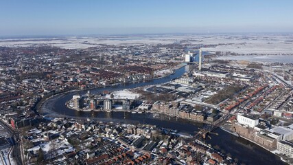 Aerial view of buildings and the IJ body of water in the Netherlands