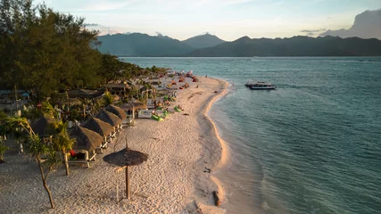 Fotobehang Aerial Bliss: Gili Air, Bali's Exotic Island Paradise with Idyllic Beach Life, Blue Waters, and Romantic Sunsets. Your Tropical Honeymoon Retreat in Asia's Indonesia © Mike Khokhlov