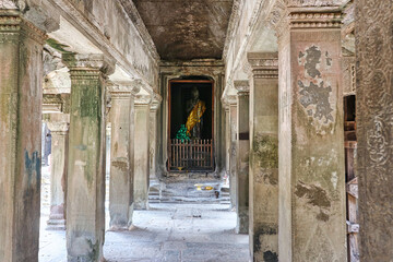 Buddha being worshipped in the outer sanctum of the Angkor wat templex complex at Siem Reap,...