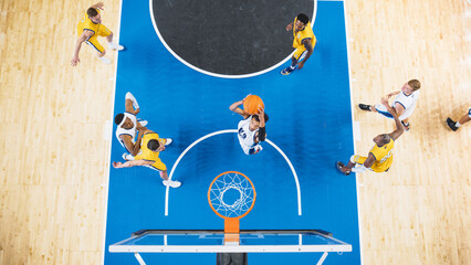 Top Down View of Talented Basketball Player Scoring Striking Slam Dunk Goal. Shot of Two International Teams Playing Basketball Match at a Professional Arena, Competing In Championship.