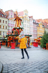 Young woman on in Christmas market in Wroclaw, Poland
