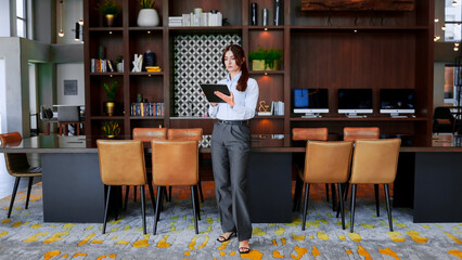 Business woman, tablet and planning in office for analytics, it innovation. Happy female worker, digital technology and website for internet search, data management or productivity online.