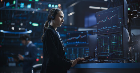 Portrait of a Beautiful Female Working in an International Stock Exchange Hall: Specialist Monitoring Equity and Share Markets, Communicating with Clients, Working with Corporate Business Partners