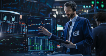 Portrait of a Stylish Man Working in an International Stock Exchange Company: Specialist Monitoring...