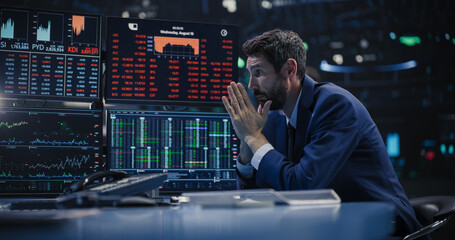 Stressed Stock Exchange Trader Can't Apprehend a Sudden Stock Market Collapse. Financial Crisis Concept with Stock Broker Saddened by Negative Ticker Information, Red Graphs and Real-Time Data - obrazy, fototapety, plakaty