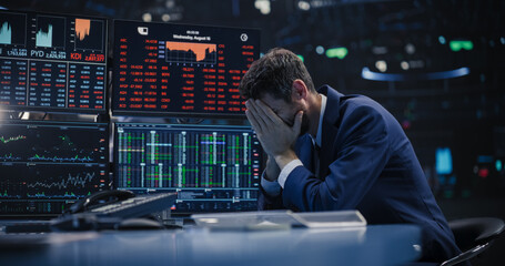 Fototapeta premium Stressed Stock Exchange Trader Can't Apprehend a Sudden Stock Market Collapse. Financial Crisis Concept with Stock Broker Saddened by Negative Ticker Information, Red Graphs and Real-Time Data