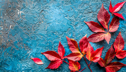 autumn background with colored red leaves on blue slate background top view copy space ai generated