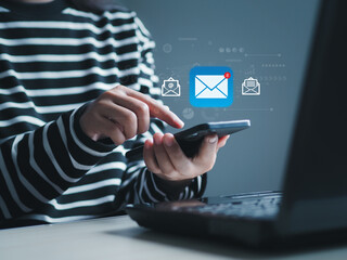 Businessman touching a smartphone screen New email notification ideas for business email communication and digital marketing. Inbox receives electronic message notifications