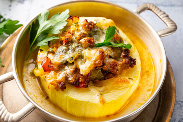 Round zucchini baked with minced meat and cheese close up