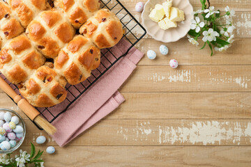 Easter Hot cross buns. Traditional Easter treats cross buns with raisins, butter, chocolate candy...