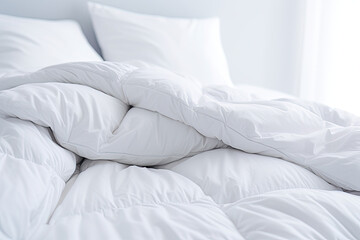 Fototapeta na wymiar White folded duvet lying on white bed background. Preparing for household, domestic activities, hotel or home textile, white bright light and room. 