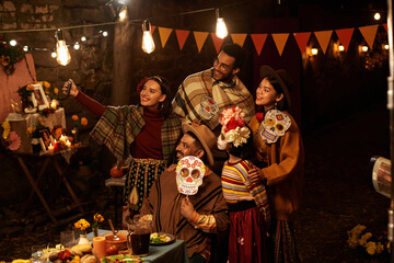 Group of people in traditional clothes making selfie portrait together during holiday