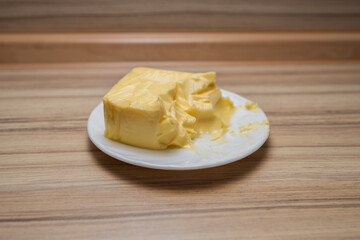 A piece of butter on a plate