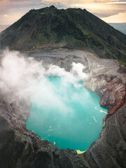 Aerial Serenity: Java's Mount Ijen at Sunrise, Revealing the World's Largest Highly Acidic Lake...