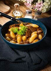 Beef stew in gravy.