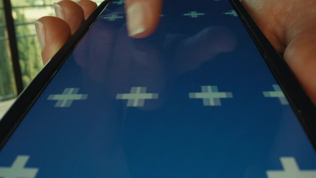 Female fingers swiping left and right on the phone screen. Wide angle shot of woman use smartphone with blue chroma key display screen. Mockup for app design
